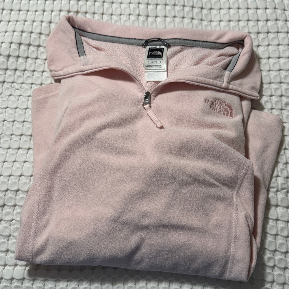 The North Face Light Pink Fleece Pullover. Fits more like a medium/large.